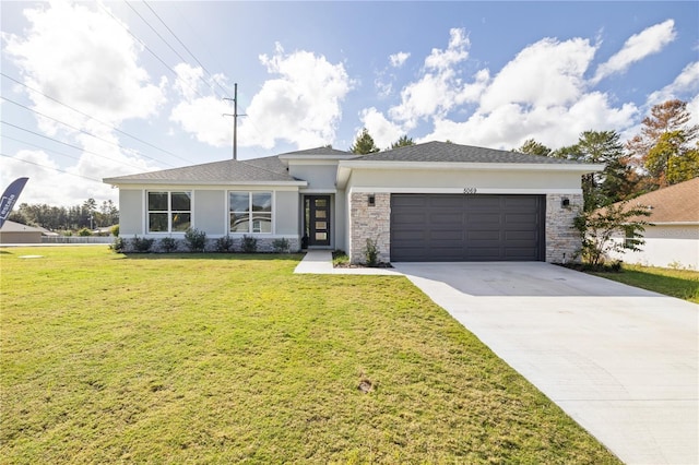 2647 SW 178th St, Ocala, FL 34473 - view of front of house featuring an attached garage, stucco siding, a front yard, and driveway