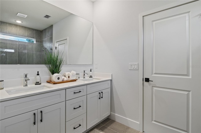 2647 SW 178th St, Ocala, FL 34473 - bathroom with double vanity, a tile shower, tile patterned floors, and baseboards