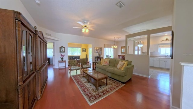 2323 NW 55th Avenue Rd, Ocala, FL 34482 - living area with wood finished floors, plenty of natural light, and a chandelier