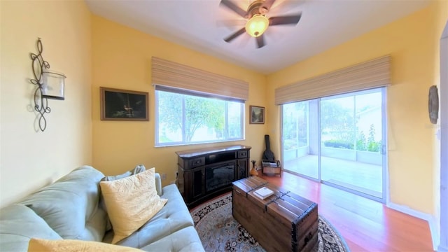 2323 NW 55th Avenue Rd, Ocala, FL 34482 - living room featuring wood finished floors and a ceiling fan