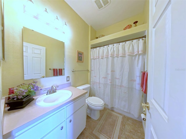 2323 NW 55th Avenue Rd, Ocala, FL 34482 - full bathroom with toilet, vanity, and tile patterned floors