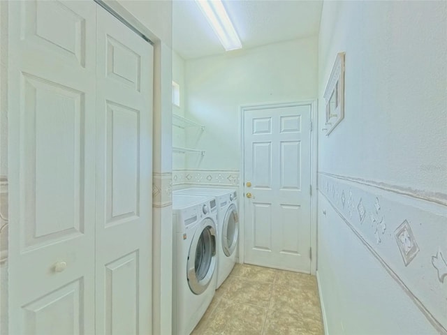 2323 NW 55th Avenue Rd, Ocala, FL 34482 - washroom featuring washer and clothes dryer and light tile patterned floors