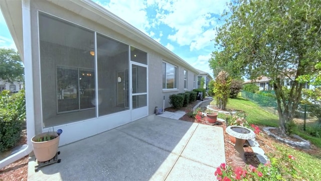 2323 NW 55th Avenue Rd, Ocala, FL 34482 - view of patio featuring a sunroom