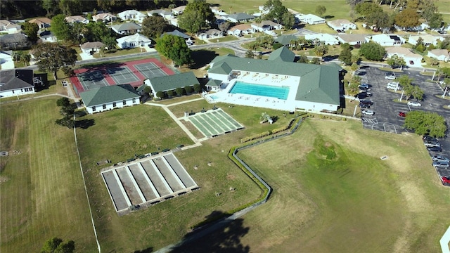 2323 NW 55th Avenue Rd, Ocala, FL 34482 - aerial view of property's location featuring a pool and nearby suburban area