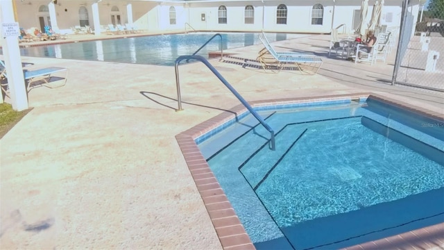 2323 NW 55th Avenue Rd, Ocala, FL 34482 - community pool featuring a patio