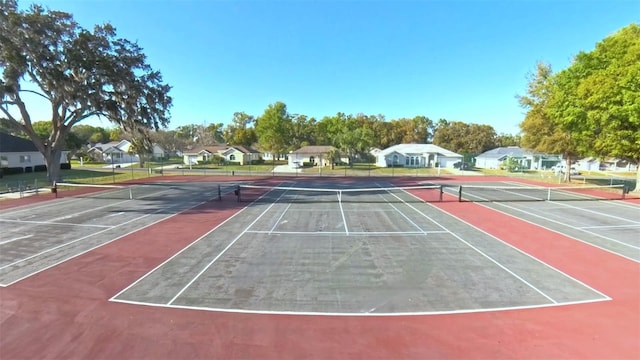 2323 NW 55th Avenue Rd, Ocala, FL 34482 - view of tennis court with a residential view and community basketball court