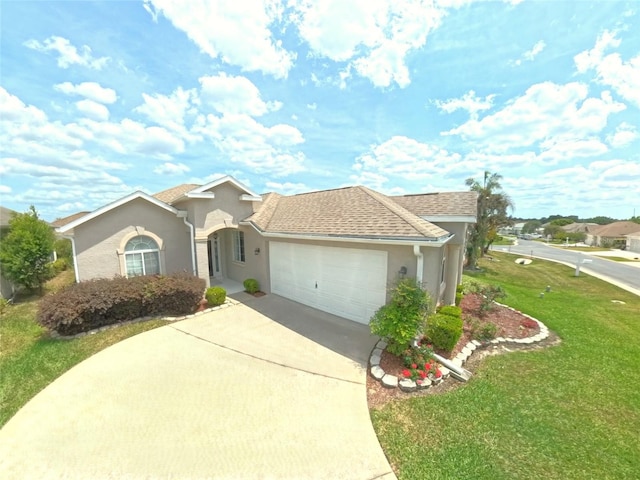 2323 NW 55th Avenue Rd, Ocala, FL 34482 - view of front of property with a front yard, stucco siding, a garage, and driveway