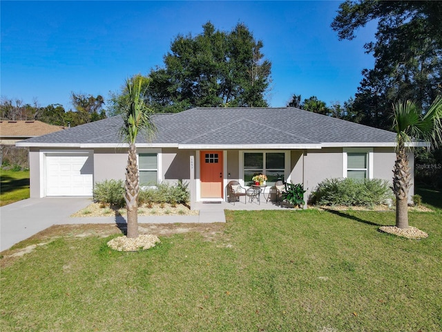 ranch-style house with stucco siding, an attached garage, a shingled roof, and a front yard