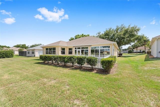 back of house featuring a yard