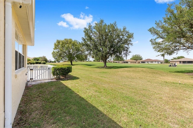 view of yard with a gate