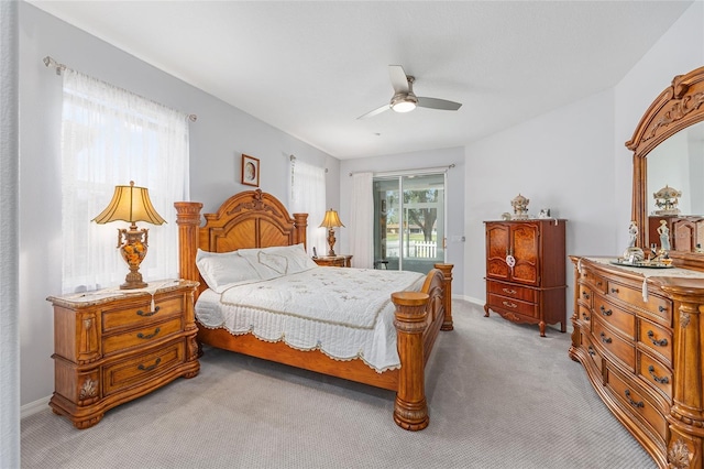 bedroom with ceiling fan, light carpet, access to outside, and baseboards