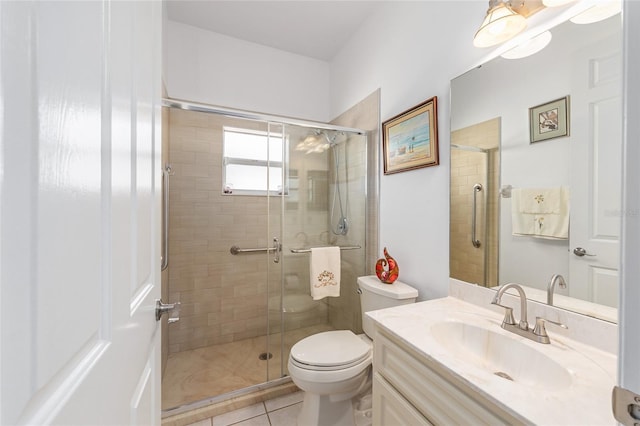 full bathroom with vanity, toilet, tile patterned flooring, and a stall shower