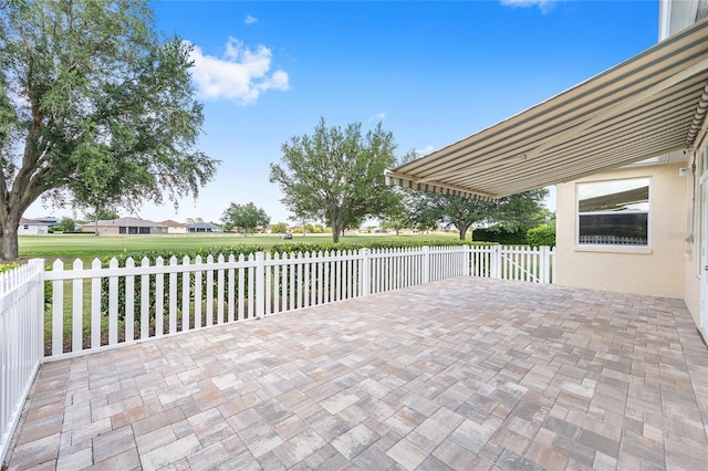 view of patio featuring fence