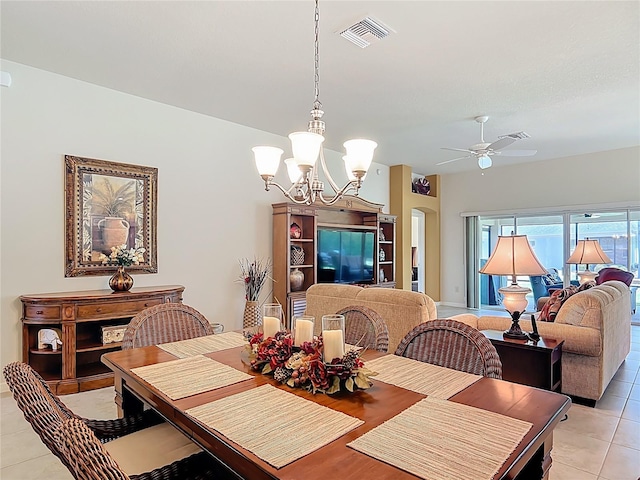 dining space featuring visible vents, ceiling fan with notable chandelier, and light tile patterned flooring