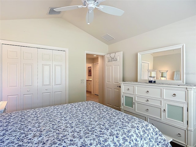bedroom with visible vents, a closet, ceiling fan, and lofted ceiling