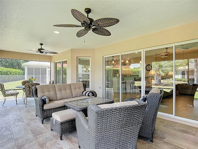 view of patio / terrace featuring an outdoor living space and a ceiling fan