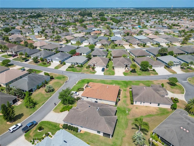 birds eye view of property with a residential view