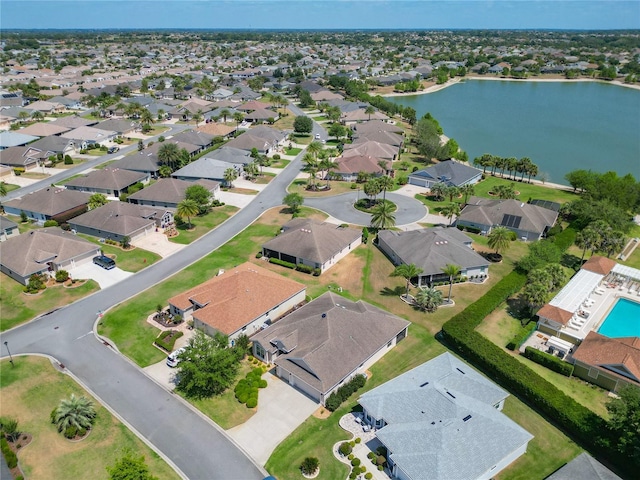 birds eye view of property with a water view and a residential view