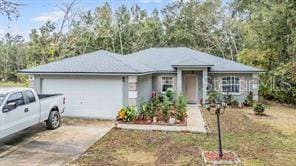 42 Dogwood Drive Crse, Ocala, FL 34472 - ranch-style home featuring driveway and an attached garage