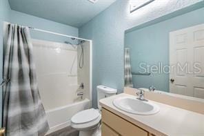 42 Dogwood Drive Crse, Ocala, FL 34472 - bathroom featuring washtub / shower combination, toilet, and vanity