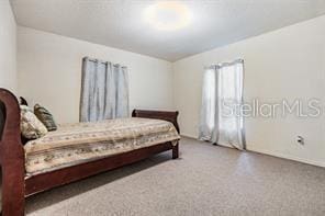42 Dogwood Drive Crse, Ocala, FL 34472 - bedroom with carpet and baseboards