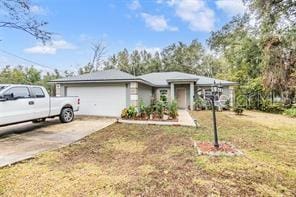 42 Dogwood Drive Crse, Ocala, FL 34472 - ranch-style house featuring concrete driveway, a front lawn, and a garage
