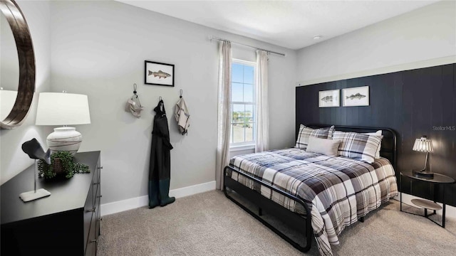 bedroom featuring baseboards and carpet floors