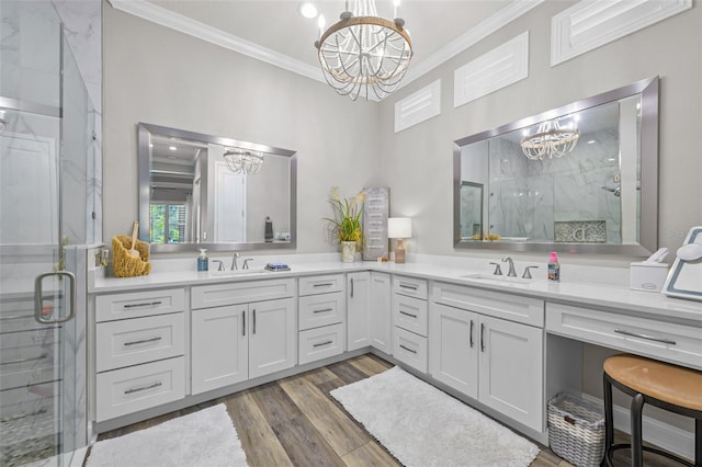 bathroom featuring a marble finish shower, ornamental molding, and a notable chandelier