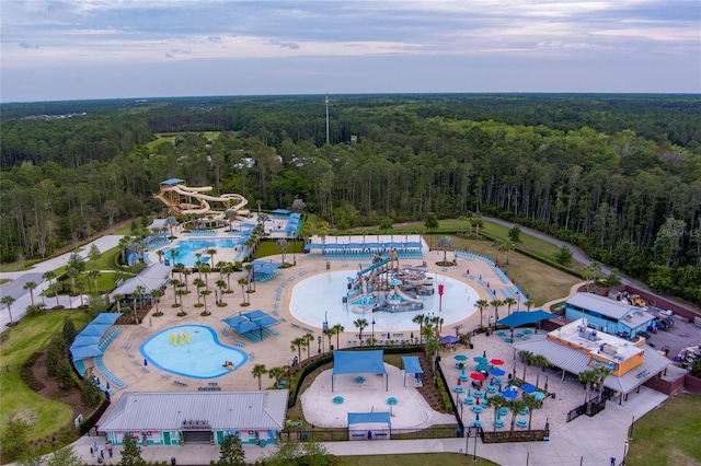 aerial view featuring a wooded view