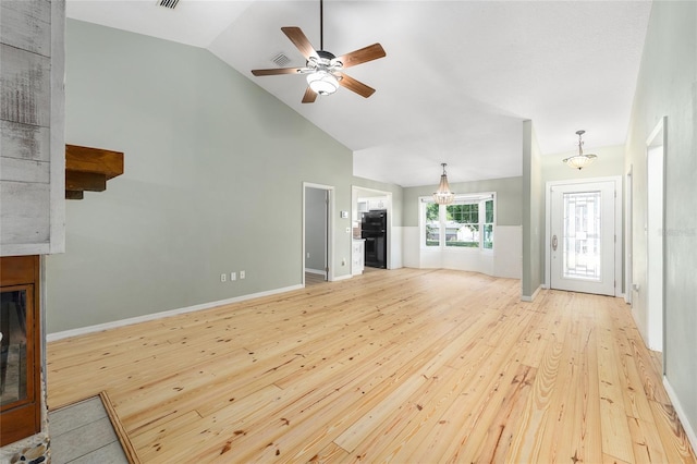 8 Banyan Dr, Ocala, FL 34472 - unfurnished living room featuring a ceiling fan, baseboards, a glass covered fireplace, and light wood-style flooring