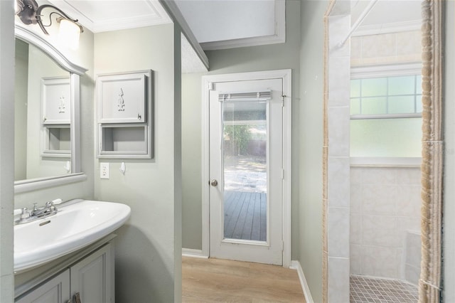 8 Banyan Dr, Ocala, FL 34472 - full bathroom with a tile shower, ornamental molding, wood finished floors, and vanity