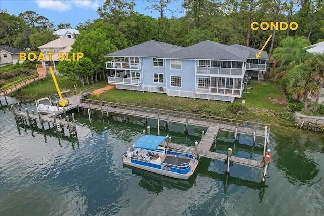 255 NW Bay Path Dr, Crystal River, FL 34428 - dock area with boat lift, a water view, and a balcony