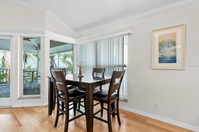 255 NW Bay Path Dr, Crystal River, FL 34428 - dining space featuring crown molding, baseboards, light wood-type flooring, and lofted ceiling
