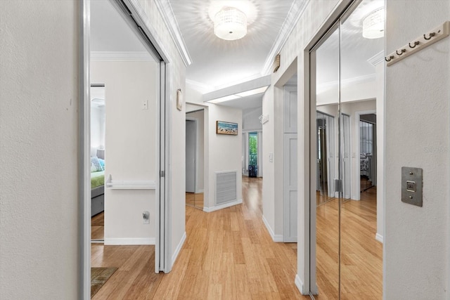 255 NW Bay Path Dr, Crystal River, FL 34428 - corridor with crown molding, light wood finished floors, baseboards, and visible vents