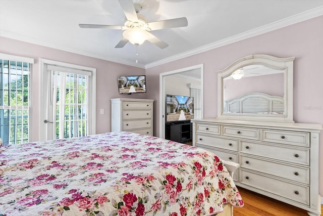 255 NW Bay Path Dr, Crystal River, FL 34428 - bedroom featuring access to outside, ornamental molding, ceiling fan, and wood finished floors