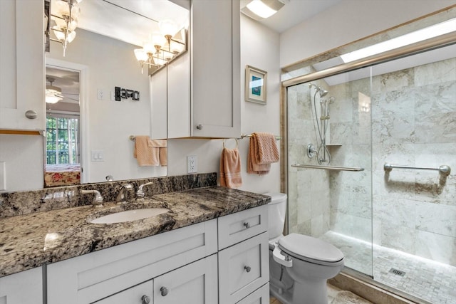 255 NW Bay Path Dr, Crystal River, FL 34428 - ensuite bathroom with vanity, ensuite bathroom, a stall shower, and toilet