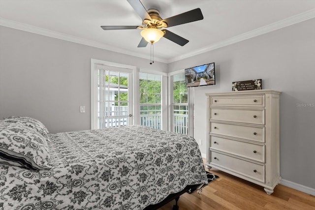 255 NW Bay Path Dr, Crystal River, FL 34428 - bedroom with access to outside, baseboards, ornamental molding, and light wood finished floors