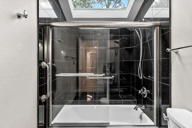 255 NW Bay Path Dr, Crystal River, FL 34428 - bathroom featuring toilet, a skylight, and bath / shower combo with glass door