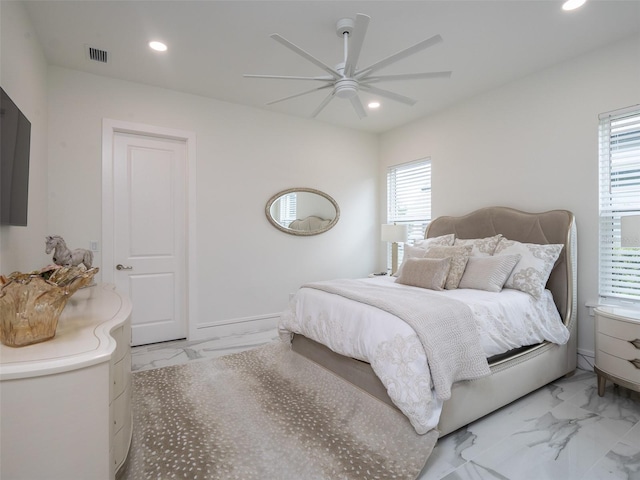 bedroom featuring visible vents, recessed lighting, and marble finish floor
