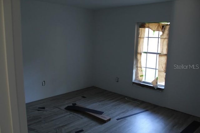 9455 SW 31st Ct, Ocala, FL 34476 - unfurnished room with wood finished floors and plenty of natural light