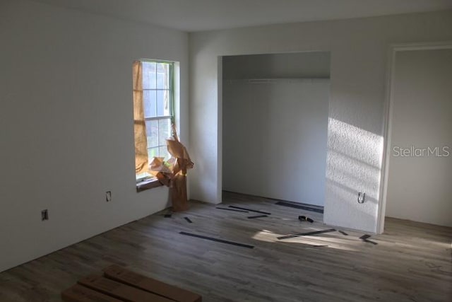 9455 SW 31st Ct, Ocala, FL 34476 - unfurnished bedroom featuring wood finished floors