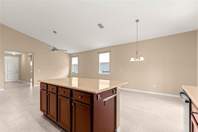 kitchen featuring light countertops, visible vents, baseboards, dishwasher, and lofted ceiling