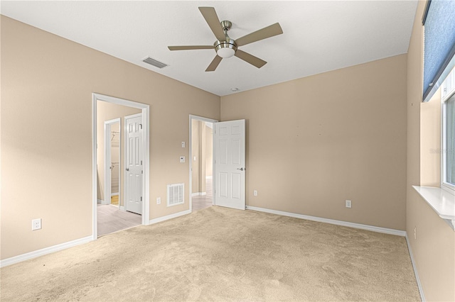 unfurnished bedroom with baseboards, visible vents, and carpet floors