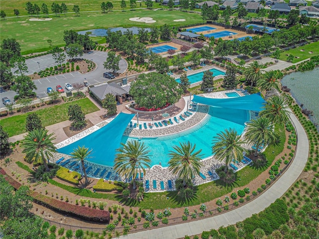 bird's eye view featuring a water view and view of golf course