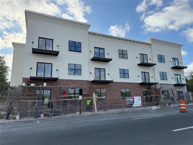 415 SE 1st Ave Unit 101-B, Ocala, FL 34471 - view of building exterior featuring fence
