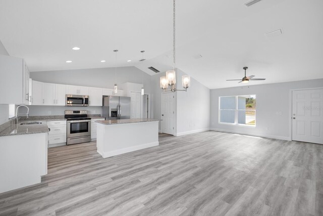 13493 SW 112th Pl, Dunnellon, FL 34432 - kitchen with stainless steel appliances, a sink, lofted ceiling, a center island, and a chandelier