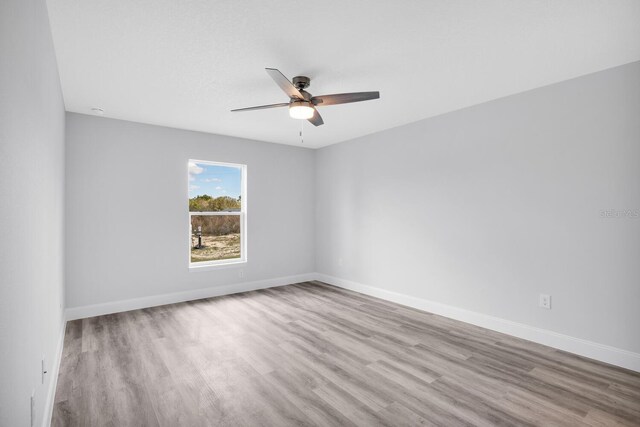 13493 SW 112th Pl, Dunnellon, FL 34432 - empty room featuring ceiling fan, wood finished floors, and baseboards