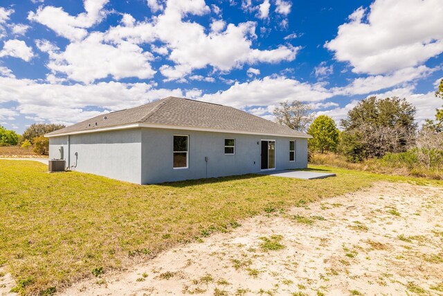 13493 SW 112th Pl, Dunnellon, FL 34432 - rear view of house featuring a patio, a lawn, and stucco siding