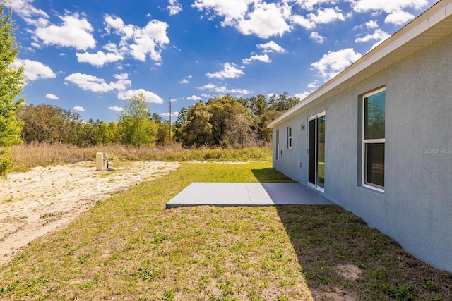 13493 SW 112th Pl, Dunnellon, FL 34432 - view of grassy yard with a patio area