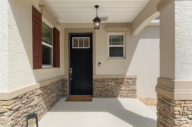 9923 SW 98th Ln, Ocala, FL 34481 - property entrance featuring stucco siding and stone siding